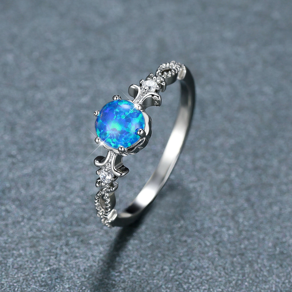 Damen Schmuckring mit opalisiertem Stein und filigranem Design Shop Nory