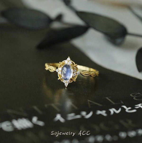 Damen eleganter Ring mit ovalem Stein und kunstvoller Fassung Shop Nory