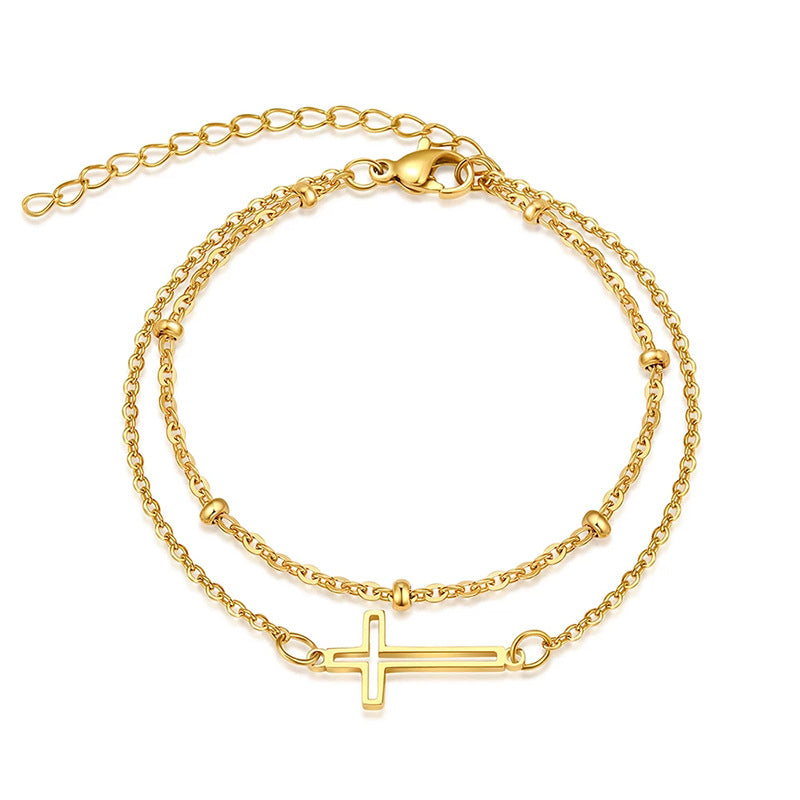 Damen Armband mit filigranem Kreuzdesign und elegantem Kettenspiel Shop Nory