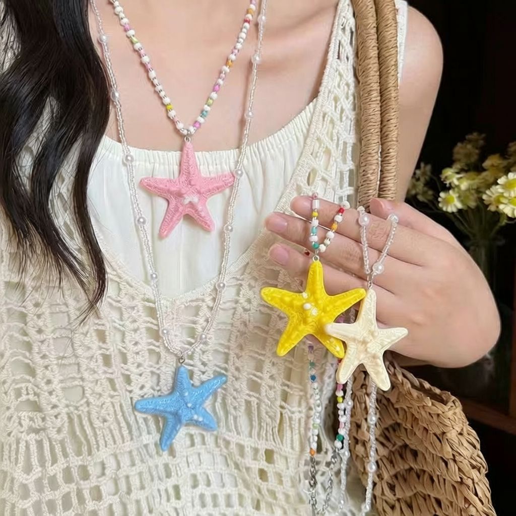 Damen Kette mit einzigartigem Sternenanhänger und buntem Perlenmuster Shop Nory