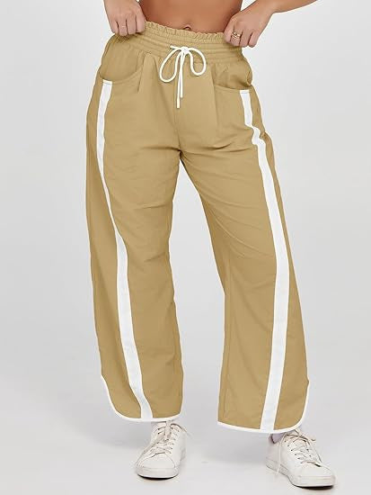 Damen nan relaxte Trackpants mit seitlichem Kontraststreifen, elastischem Smokbund und Eingrifftaschen Shop Nory