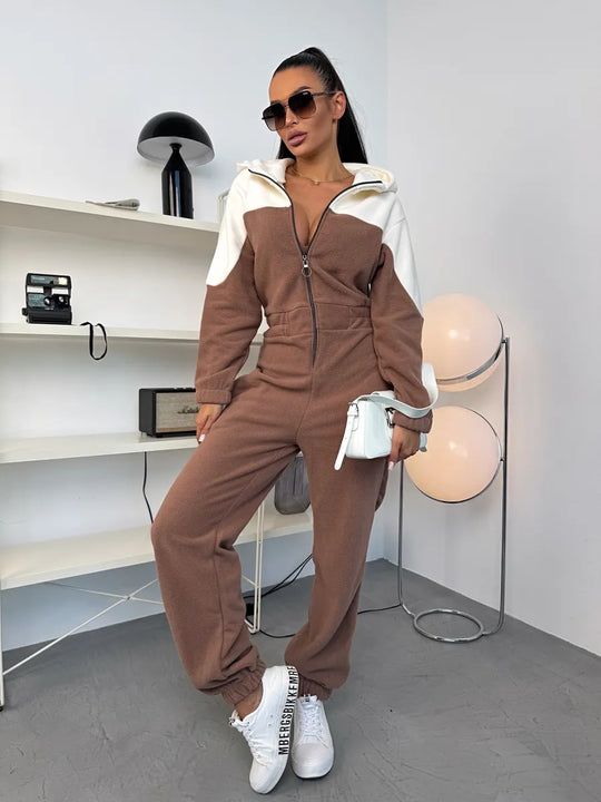 Damen gemütlicher Fleece-Overall mit Kapuze, durchgehendem Reißverschluss und elastischen Bündchen Shop Nory