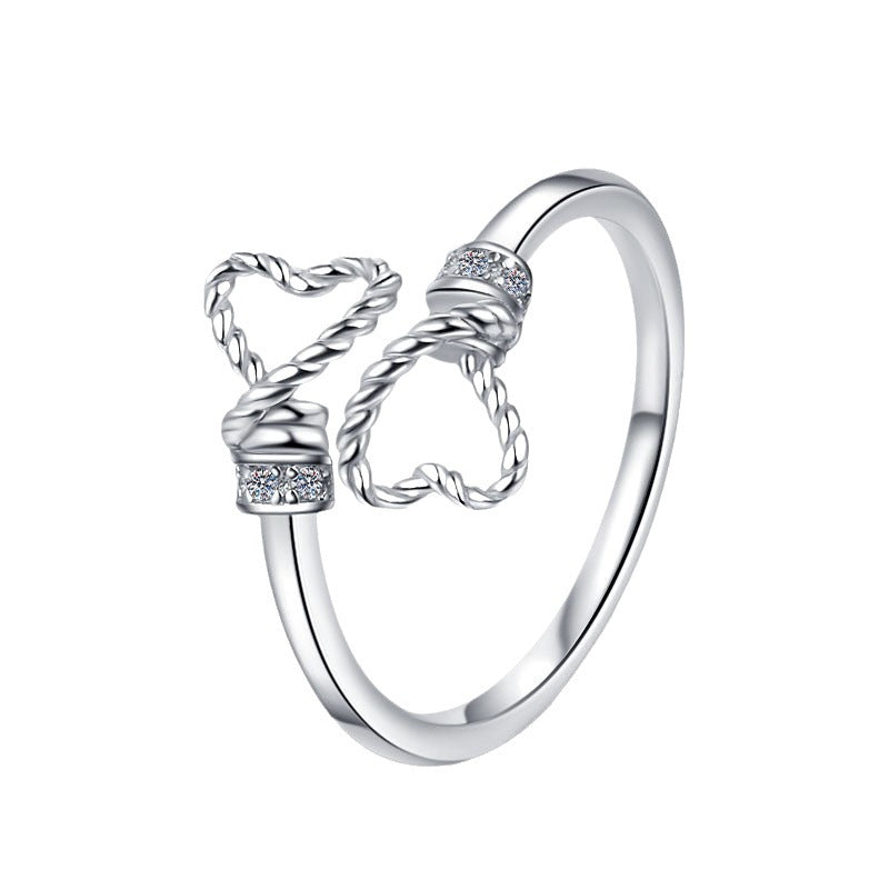 Damenring mit verschnörkeltem Herzdesign und glitzernden Zirkonia Shop Nory