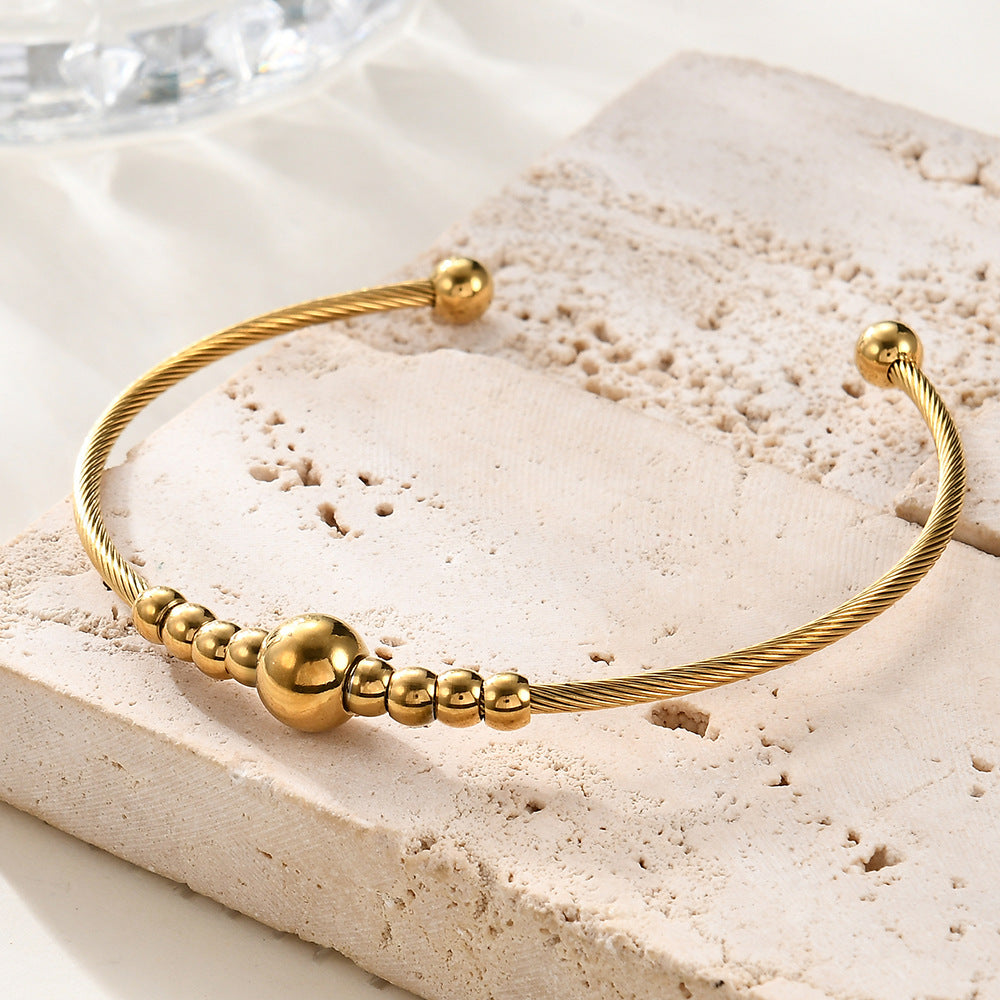 Damen Armreif mit elegantem Drahtdesign und funkelnden Kugeldetails Shop Nory