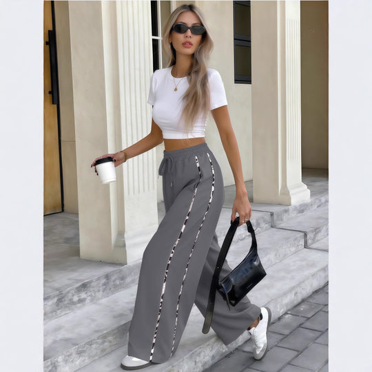 Damen Weite High‑Waist Loungehose mit Kordelzug und kontrastierenden Seitenstreifen Shop Nory