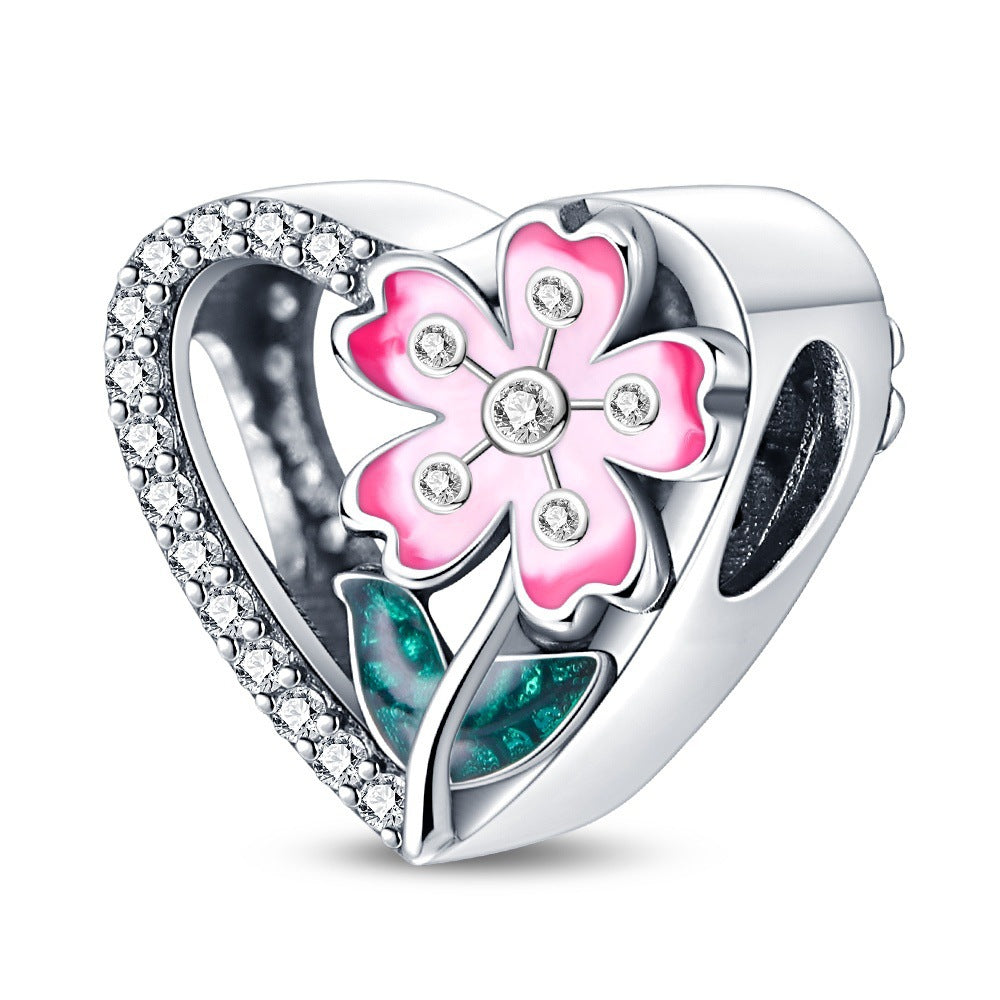 Filigraner Herz-Charms Anhänger mit Rosenmotiv und Zirkonia
