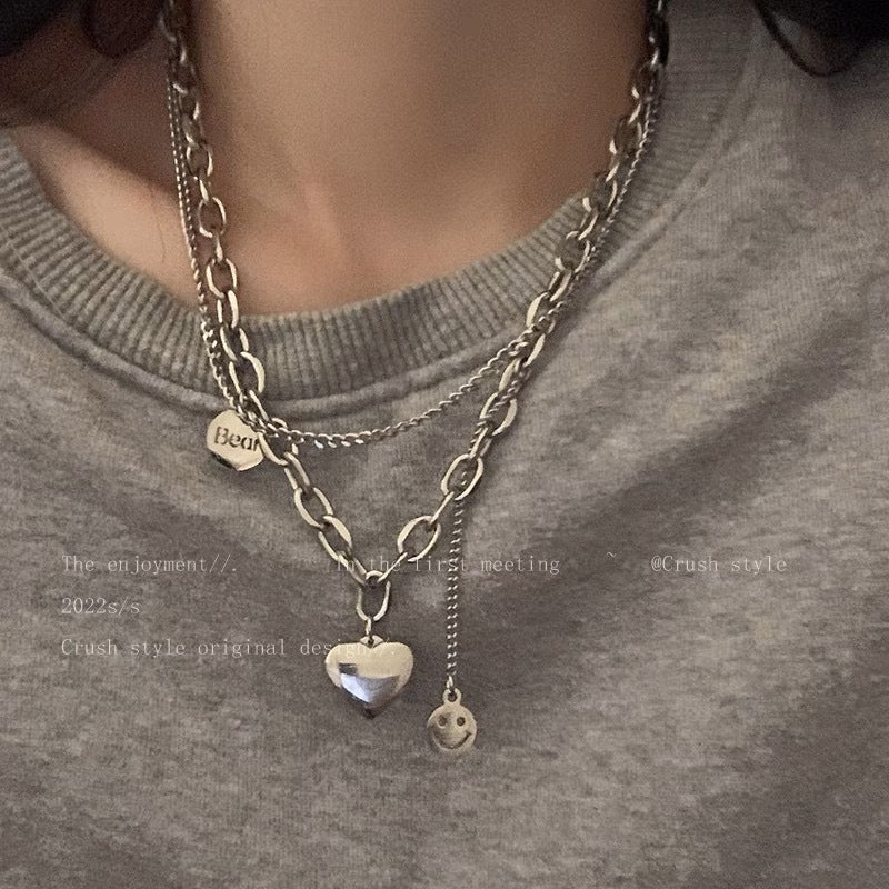 Damen Kette mit charmantem Herzen- und Smiley-Anhänger Shop Nory