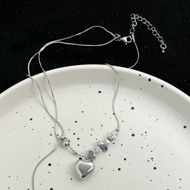 Damen Halskette mit glänzendem Herzanhänger und edlen Kristallelementen Shop Nory