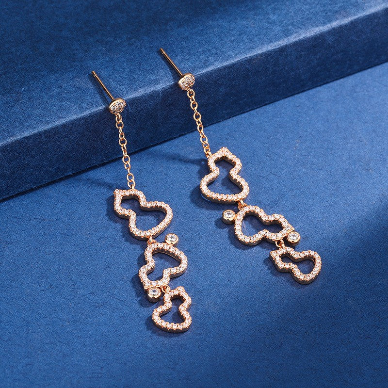Damen Ohrringe mit kunstvollem Design und funkelndem Zirkonia Shop Nory