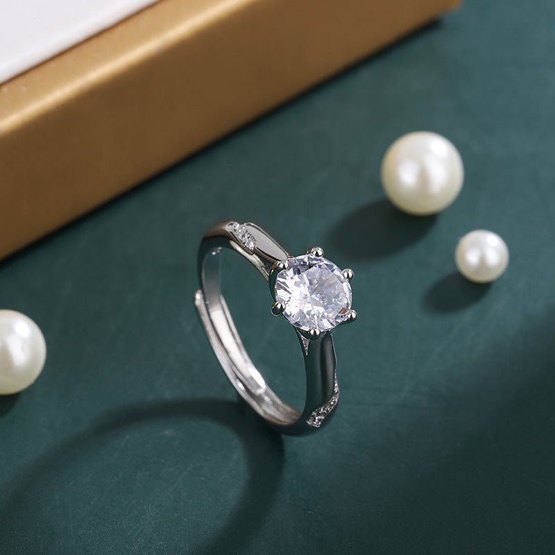 Damenring mit funkelndem Zirkonia-Hauptstein und elegant geschwungenem Design Shop Nory