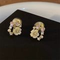Damen Ohrringe mit kunstvollem floralen Design und zarten Zirkonia Shop Nory