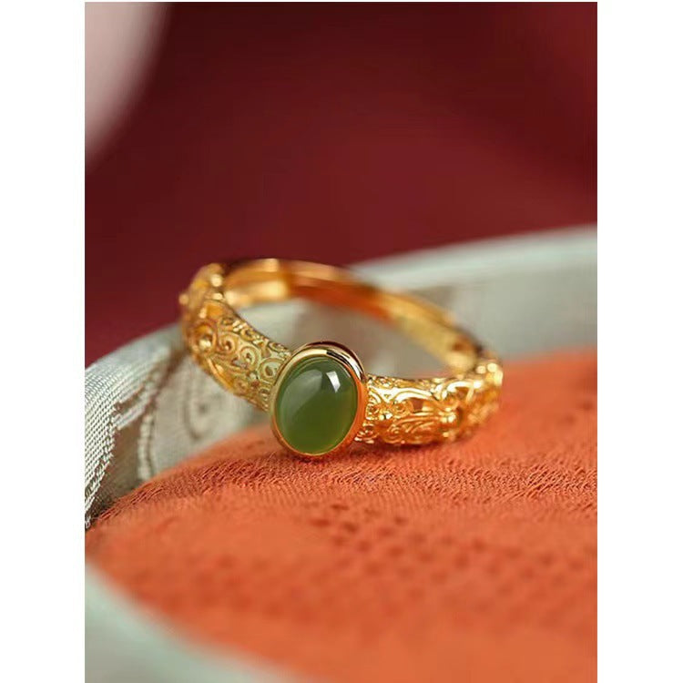 Damenring mit kunstvollem, floralem Design und grünem Edelstein Shop Nory