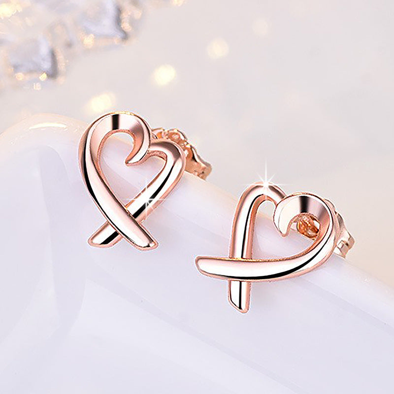 Damen Ohrstecker im herzförmigen Design mit elegantem Zirkonia-Besatz Shop Nory