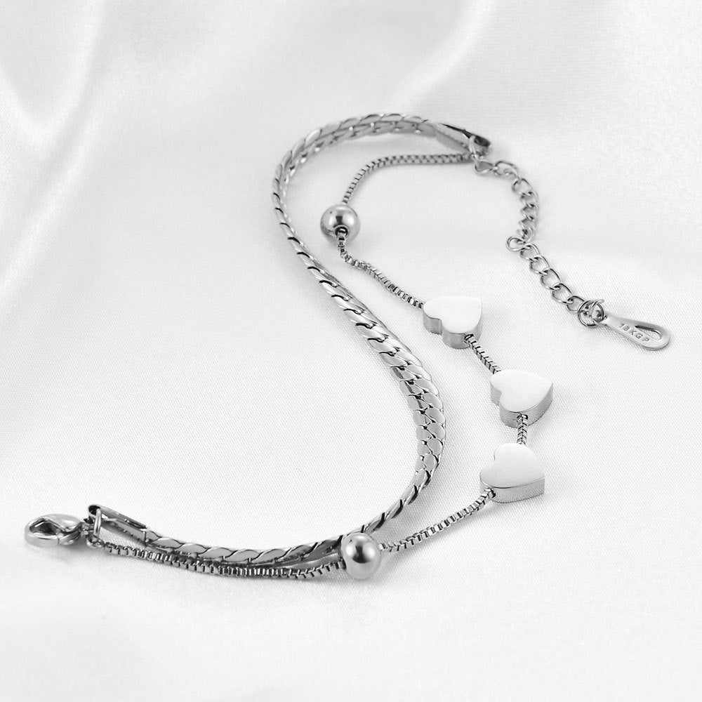 Damen Armband mit elegantem Herzdesign und feinen Kettengliedern Shop Nory