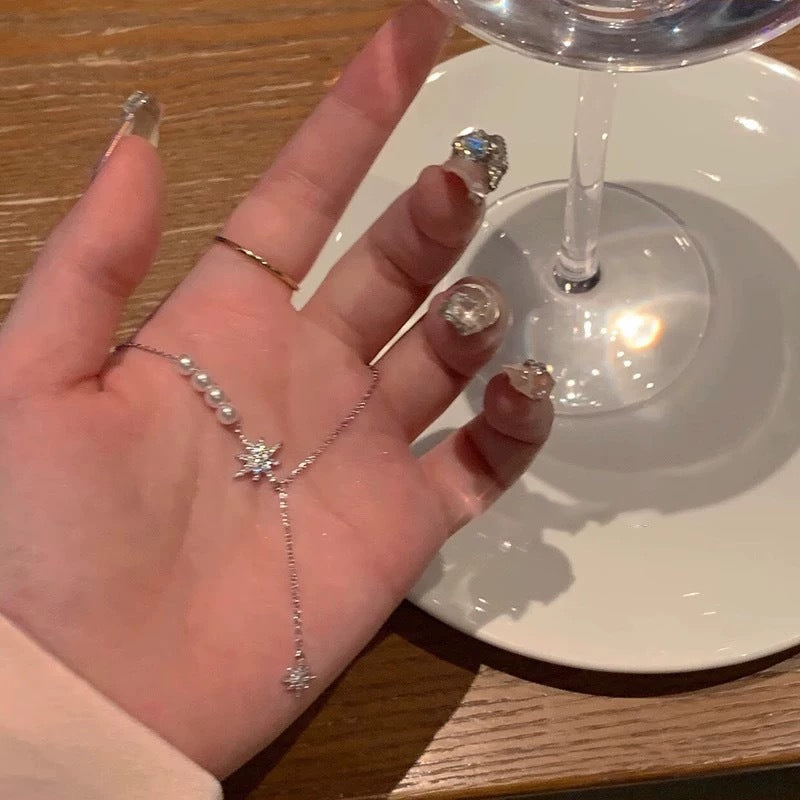 Damen funkelnde Handkette mit Perlen und Sternen Anhänger Shop Nory