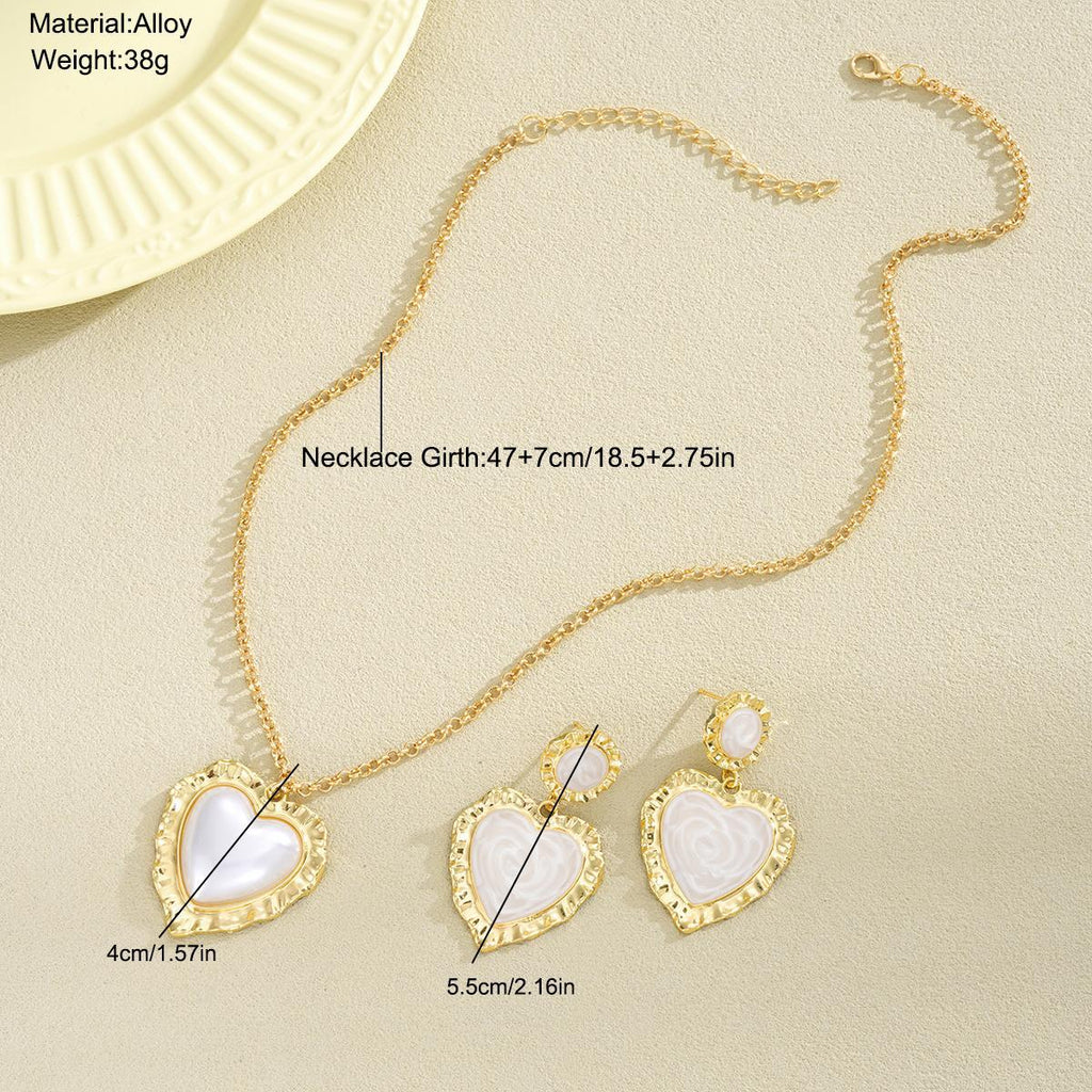 Damen Schmuckset mit herzförmigen Anhängern und eleganten Goldakzenten Shop Nory