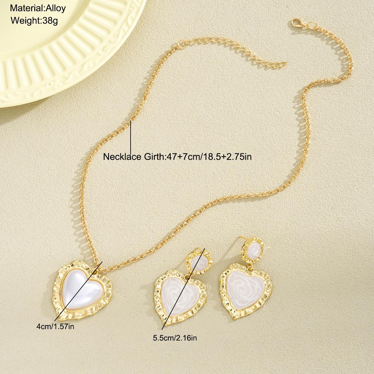 Damen Schmuckset mit herzförmigen Anhängern und eleganten Goldakzenten Shop Nory