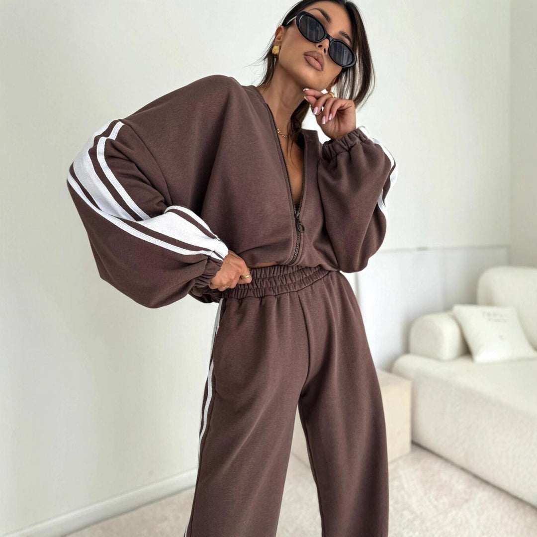 Damen cropped Zip-Hoodie mit voluminösen Ballonärmeln und High-Waist Relaxhose im sportlichen Seitenstreifen-Design Shop Nory