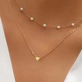 Damen Halskette mit eleganten Perlen und zarten Herzanhängern Shop Nory