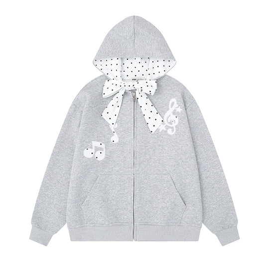 Damen Kapuzensweatjacke mit gepünktetem Kapuzenfutter, dekorativer Schleife und Notenmotiv Shop Nory