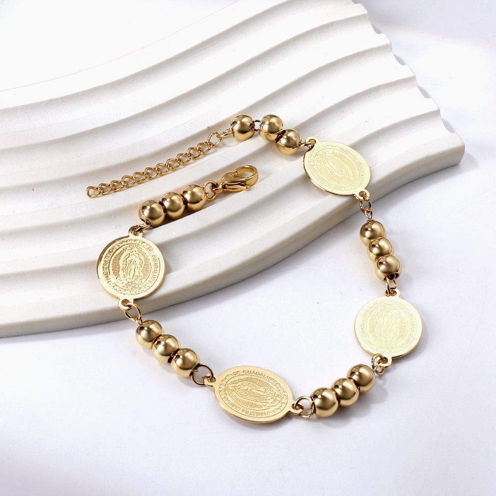 Damen Armband aus goldplattiertem Edelstahl mit Münz- und Perlenverzierungen Shop Nory
