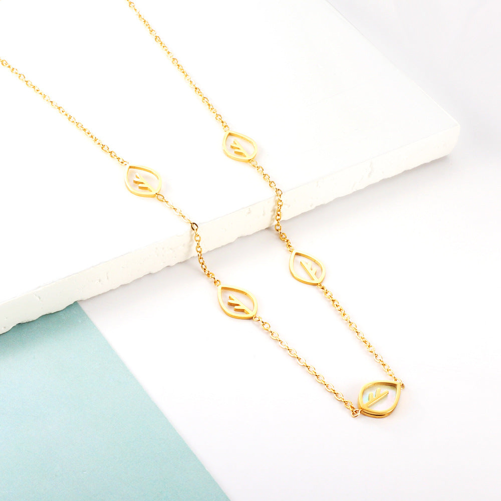 Damen Armband mit feinen Blattmotiven aus Edelstahl und goldplattierter Oberfläche Shop Nory