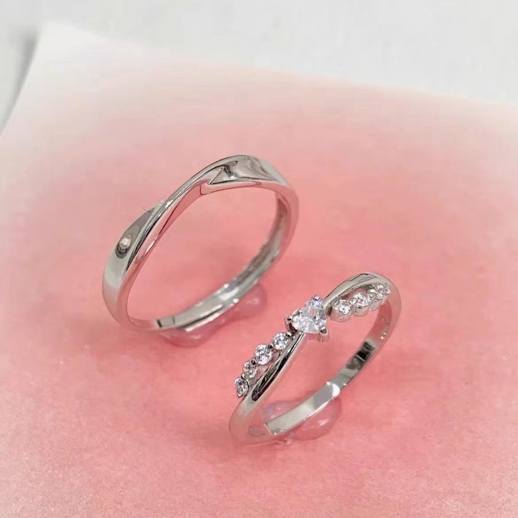 Damenring mit kunstvollem Zirkonia-Besatz und elegantem Wellen-Design Shop Nory