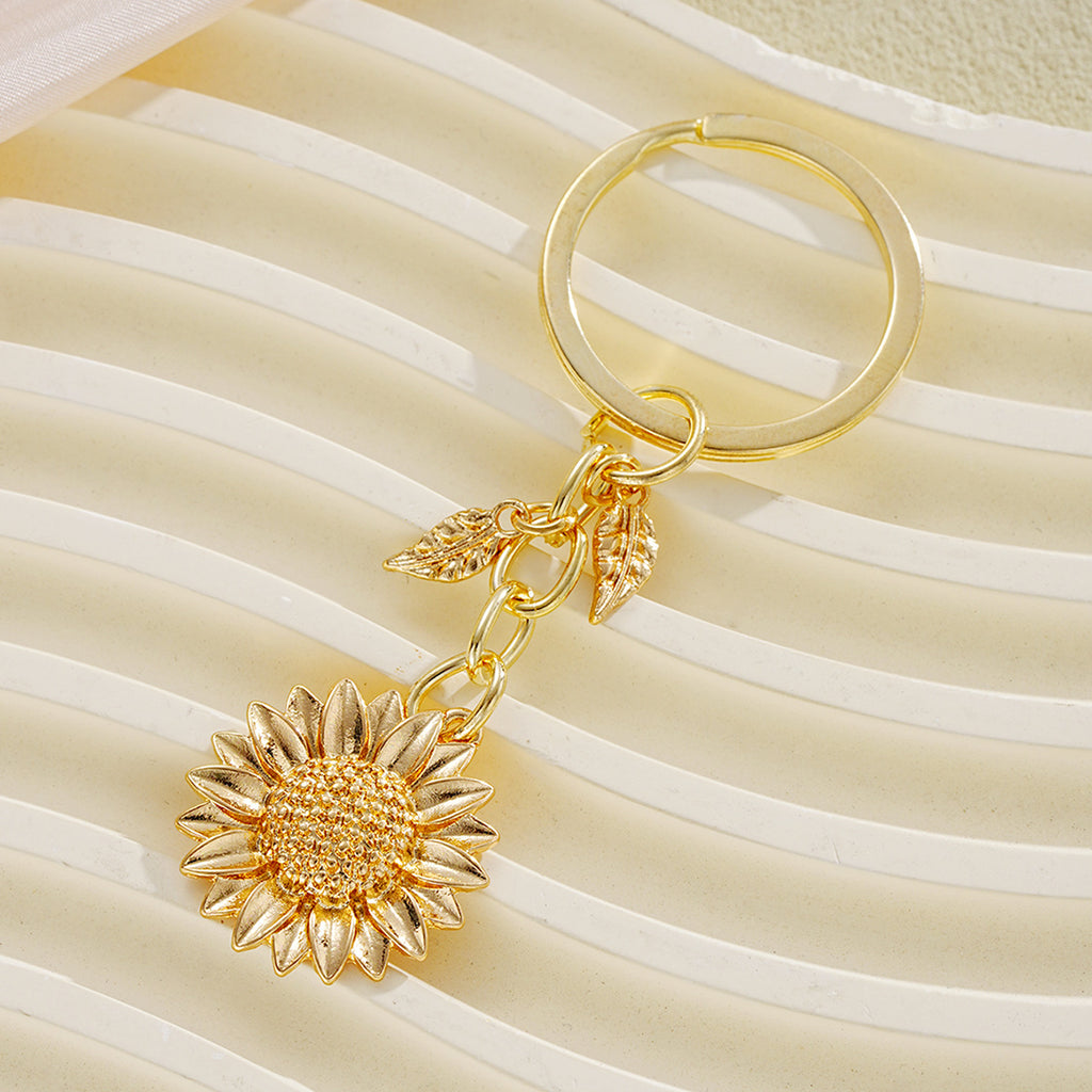 Damen Schlüsselanhänger mit filigranem Sonnenblumen-Design und elegantem Blattakzent Shop Nory