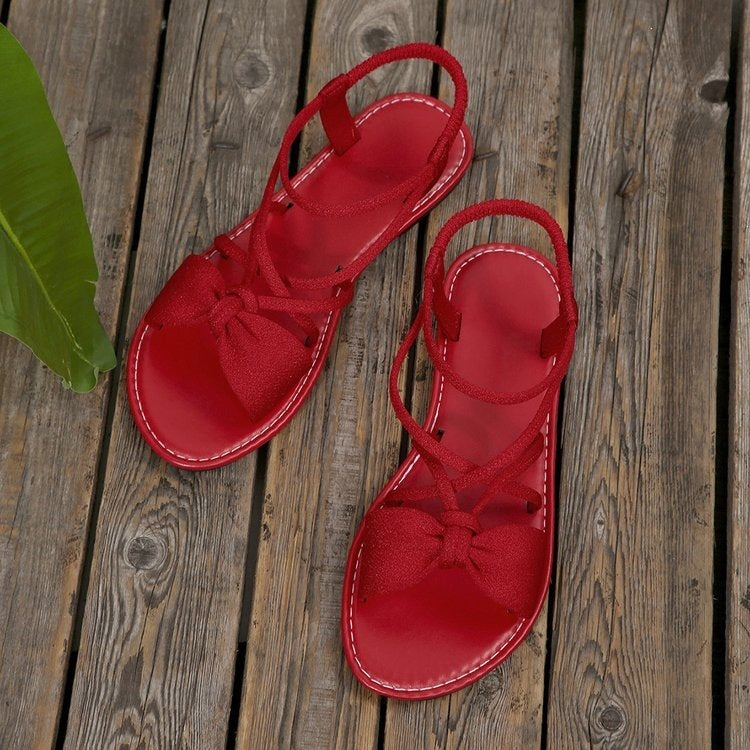 Damen Zarte Römersandalen mit Schleifen-Detail und verstellbaren Schnürriemen Shop Nory
