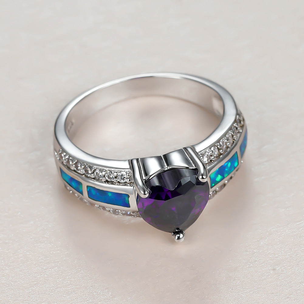 Damen Ring mit herzförmigem smaragdgrünem Stein und feinen Zirkonia-Details Shop Nory