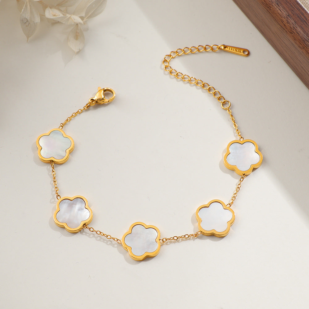 Damen zarte Armbanduhr mit floralem Design und hochwertigen Perlmutt-Elementen Shop Nory