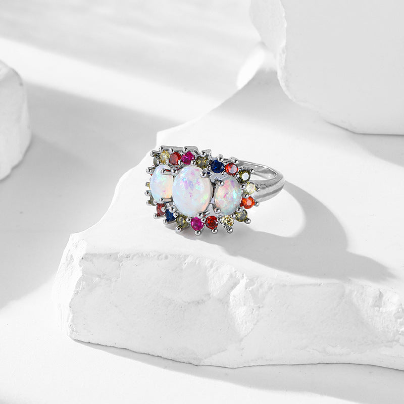 Damen eleganter Ring mit opalisierten Steinen und bunten Akzenten Shop Nory
