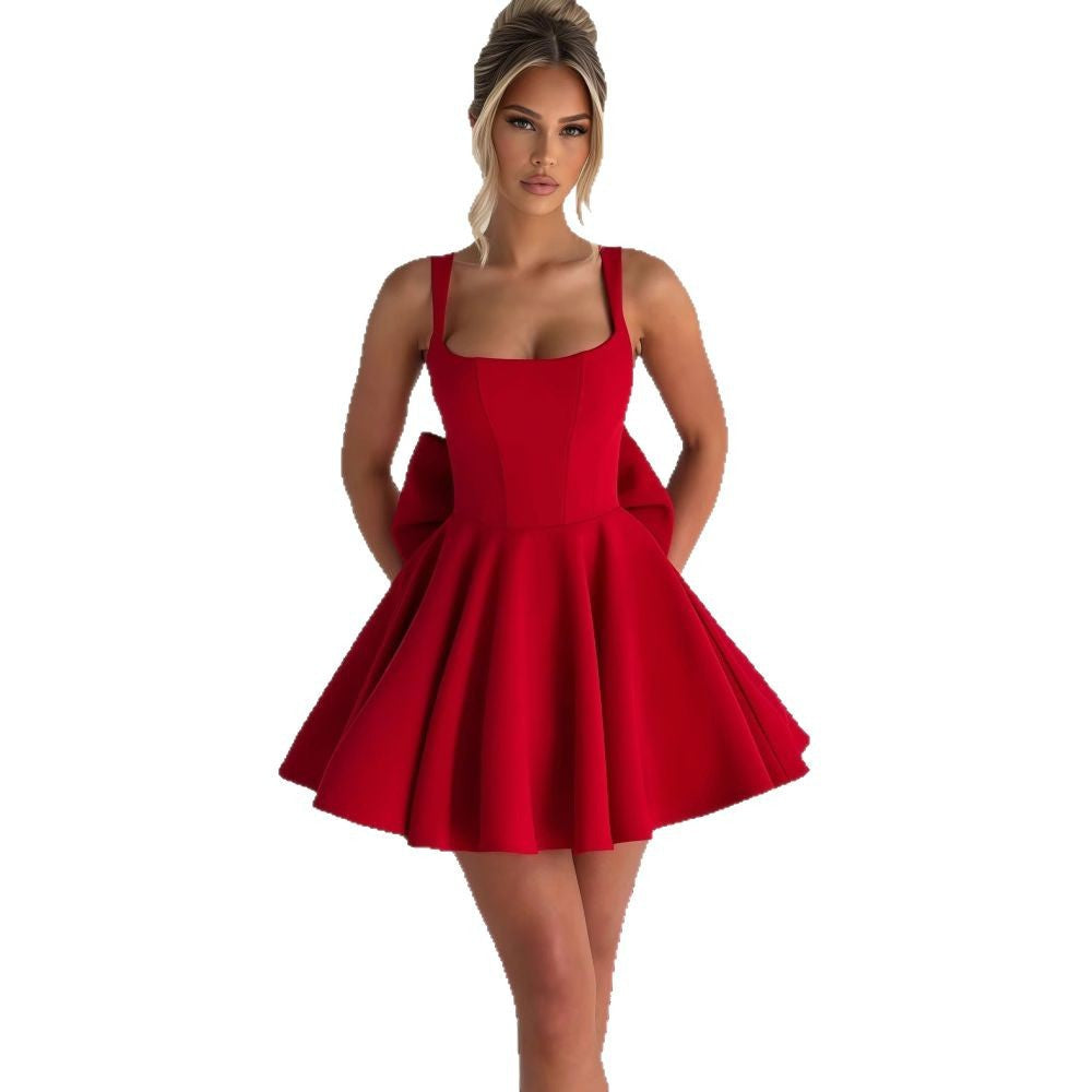 Damen Cocktailkleid mit oversized Schleifen-Design und fließendem Rock
