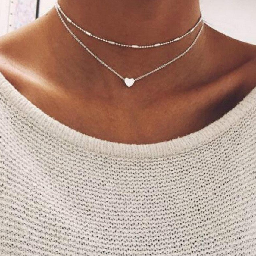Damen Halskette mit eleganten Perlen und zarten Herzanhängern Shop Nory