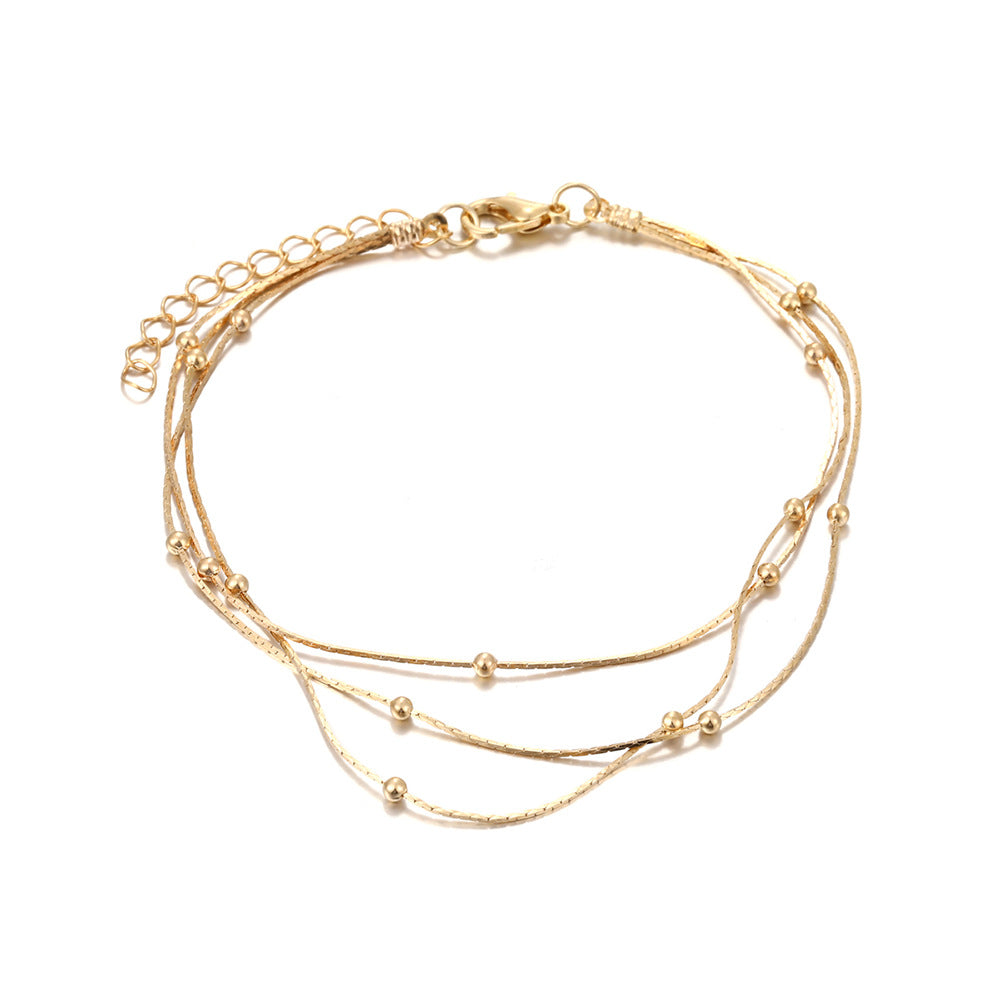 Damen Fußkettchen mit eleganten, goldenen Akzenten Shop Nory