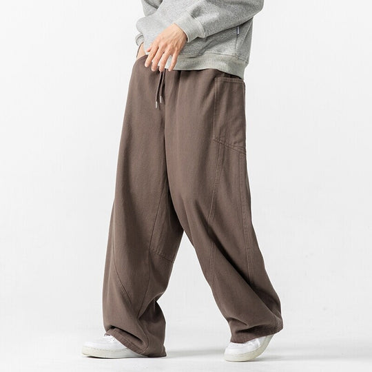 Herren Weite Loungehose mit Tunnelzug, aufgesetzten Taschen und markanten Panelnähten Shop Nory