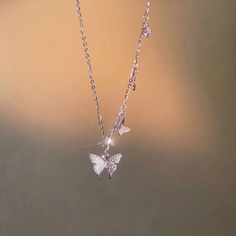 Damen Halskette mit filigranem Schmetterlingsdesign und funkelnden Zirkonia Shop Nory