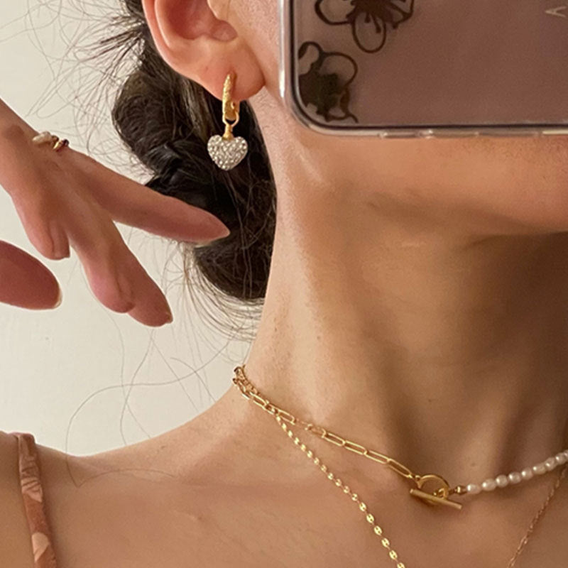 Damen Ohrringe mit glänzenden Herz-Anhängern Shop Nory