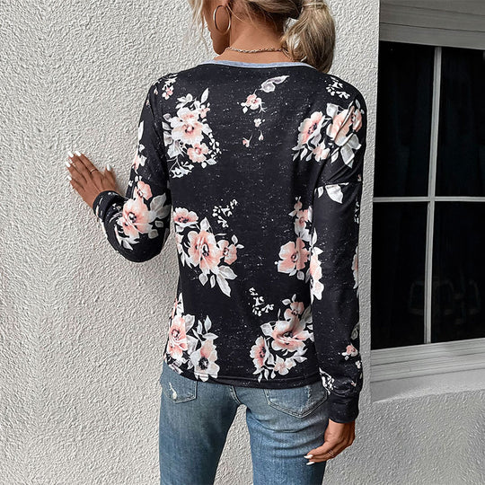 Damen Lässiges Langarm-Jerseyshirt mit kontrastiertem V‑Einsatz, Pompon‑Borte und floralem Alloverprint Shop Nory