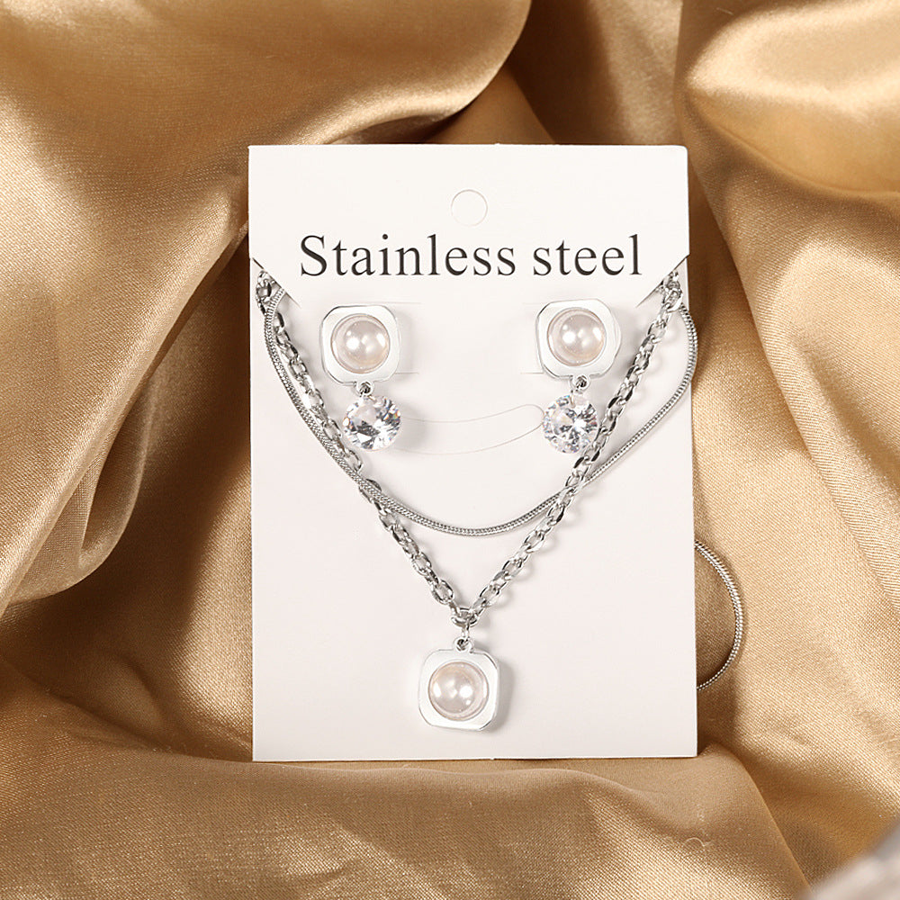 Damen Schmuckset mit modernem, eleganten Perlenanhänger und Ohrringen Shop Nory
