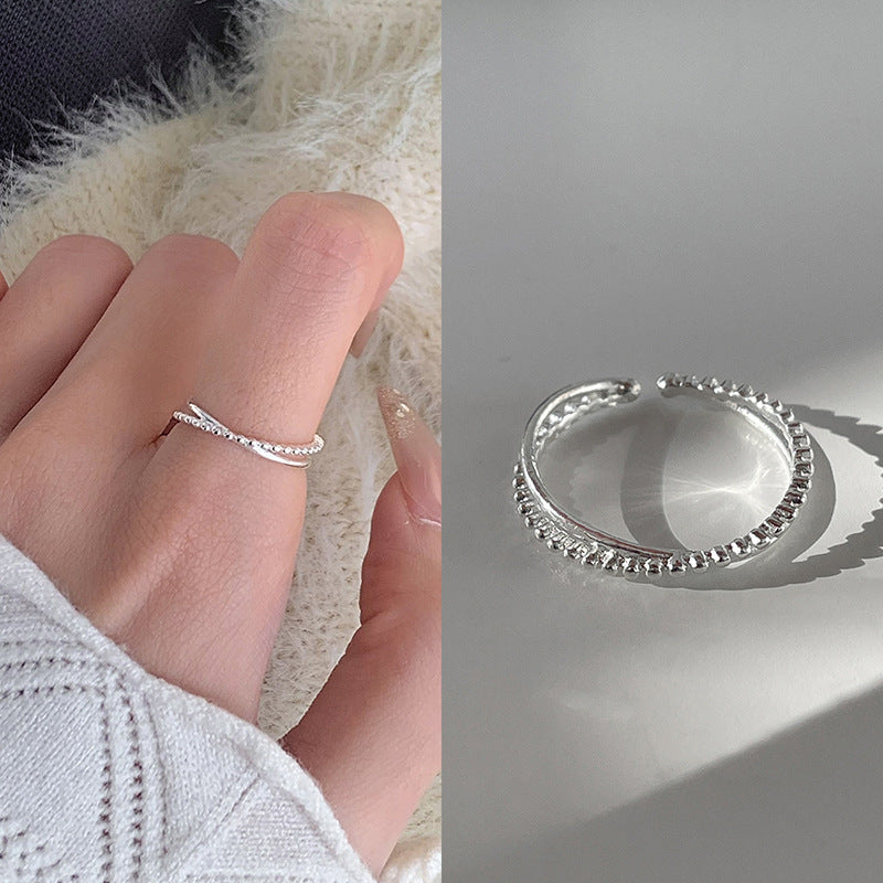 Damenring mit kunstvollem Wellen-Design und funkelnden Akzenten Shop Nory