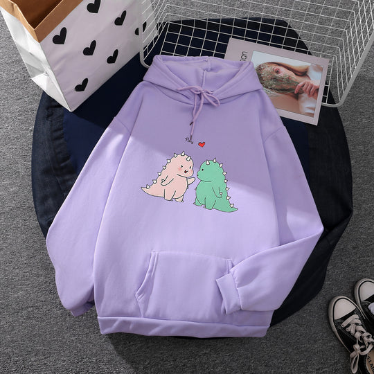 Damen nan Kapuzenpullover mit niedlicher Dinosaurierpärchen‑Illustration, Oversize‑Schnitt und Kängurutasche Shop Nory