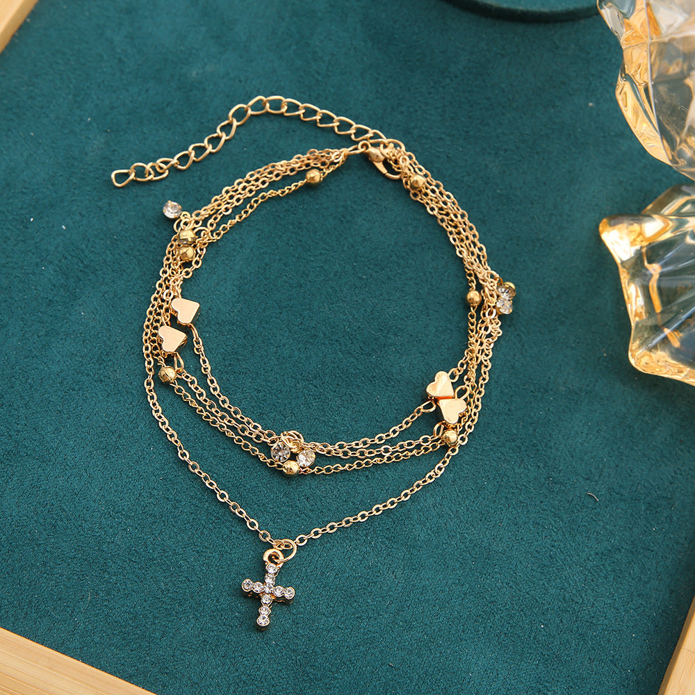 Damenarmband mit zierlichen Herz- und Perlenakzenten Shop Nory