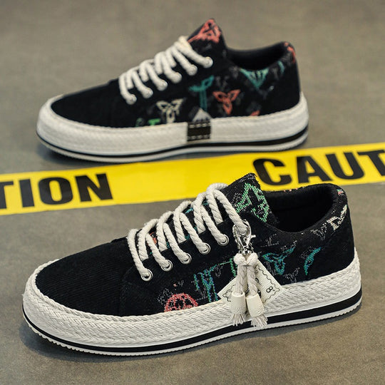 Damen bestickte Canvas‑Sneaker mit Quastenanhänger und geflochtener Plateausohle Shop Nory
