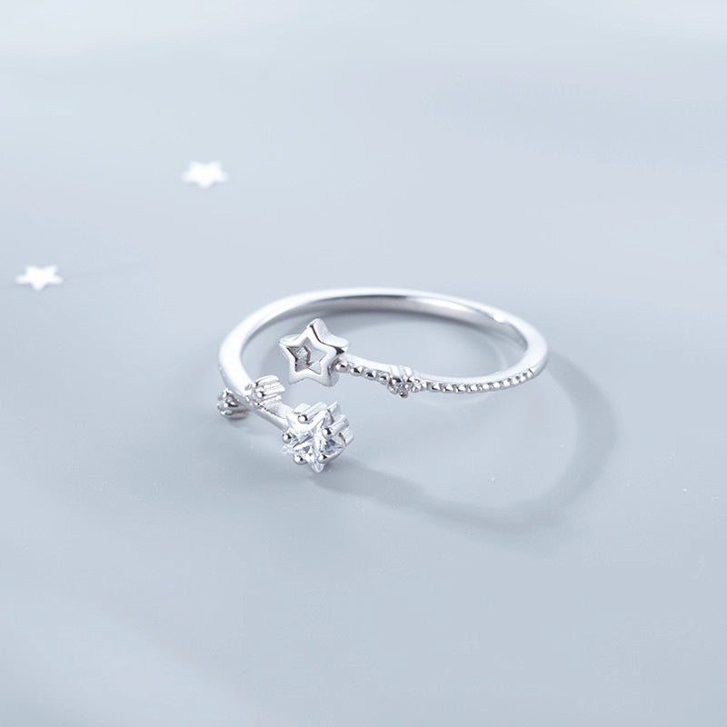 Damen eleganter und zarter Ring mit Stern- und Blütenmotiven Shop Nory