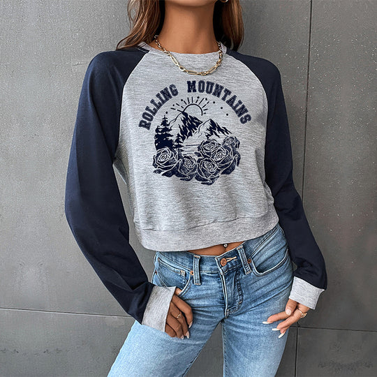 Damen Cropped Raglan-Sweatshirt mit Bergmotiv, Rippbündchen und lockerer Passform Shop Nory
