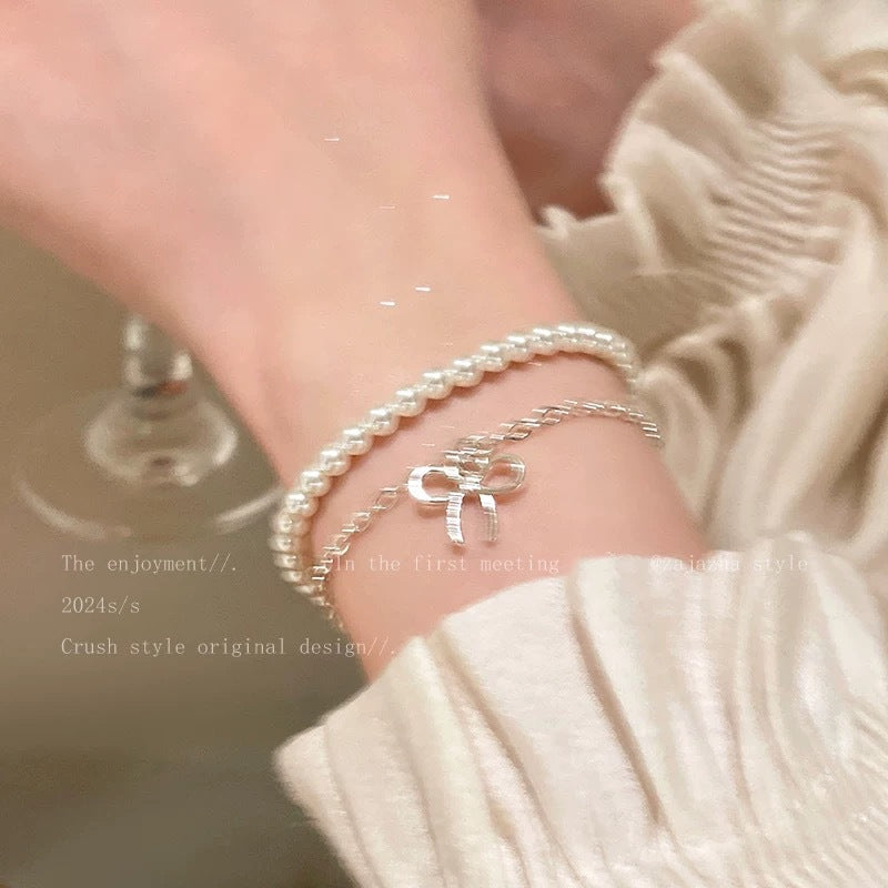 Damen Armband mit farbigen Halbedelsteinen und charmantem Schleifenanhänger Shop Nory