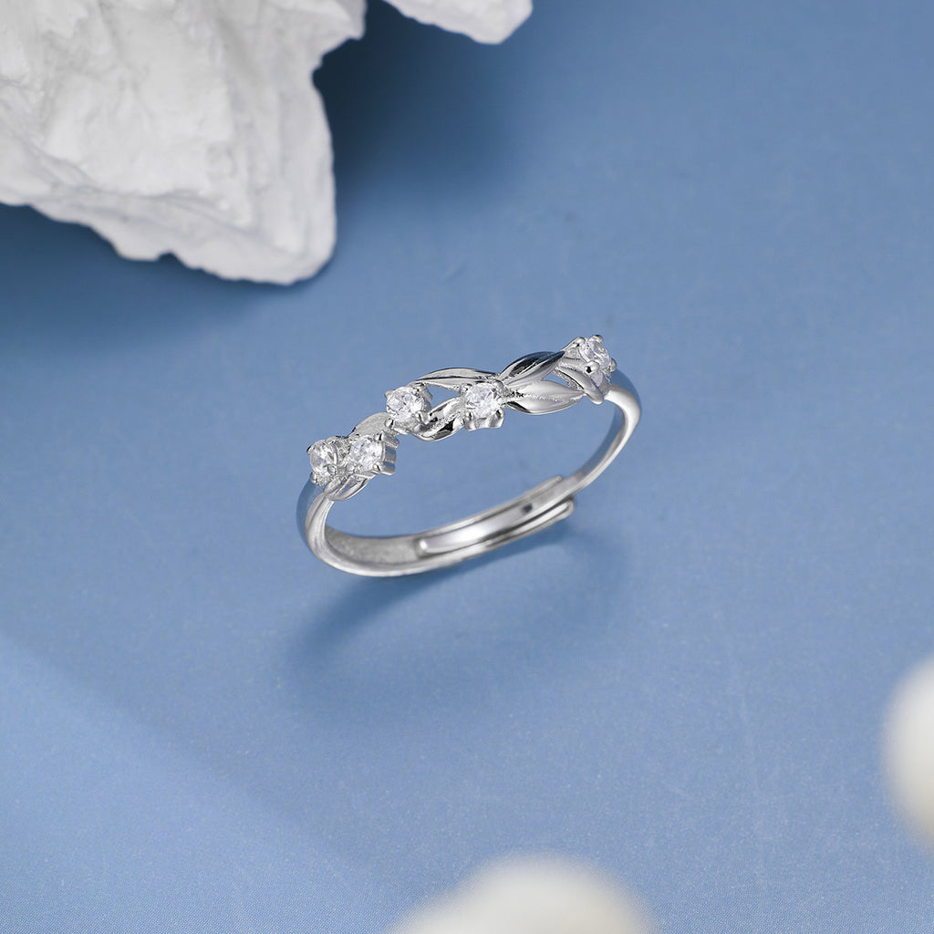 Damen eleganter Ring mit funkelnden Zirkonia und kunstvollem Blattdesign Shop Nory