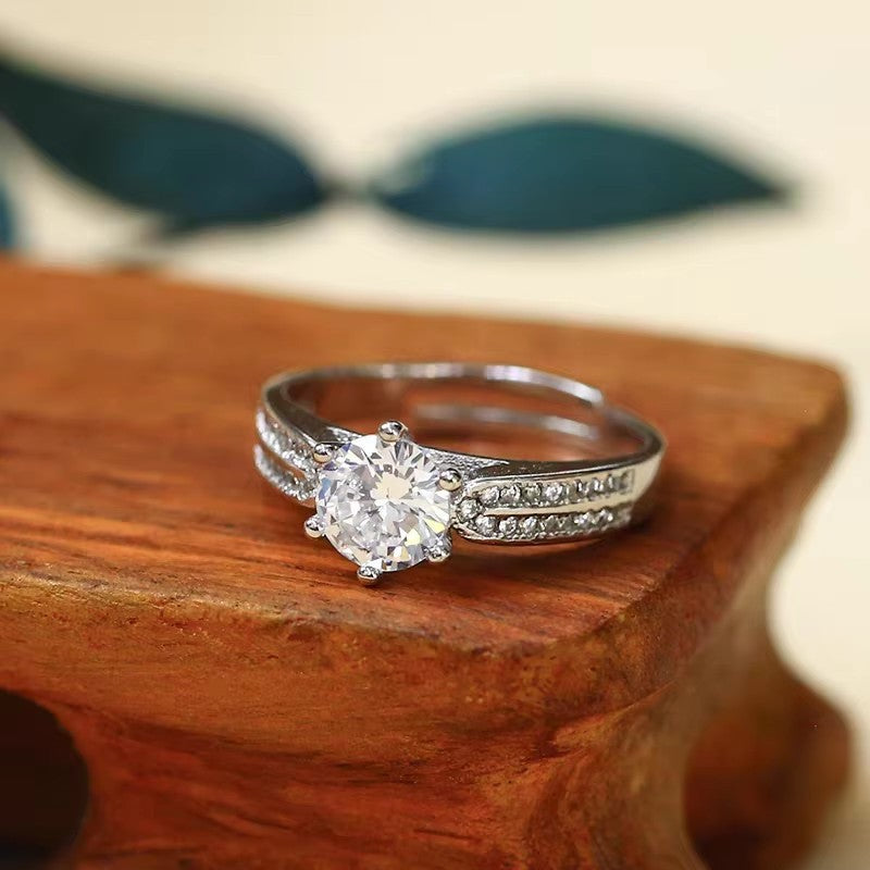 Damenring mit funkelndem Zirkonia und elegantem Band Shop Nory