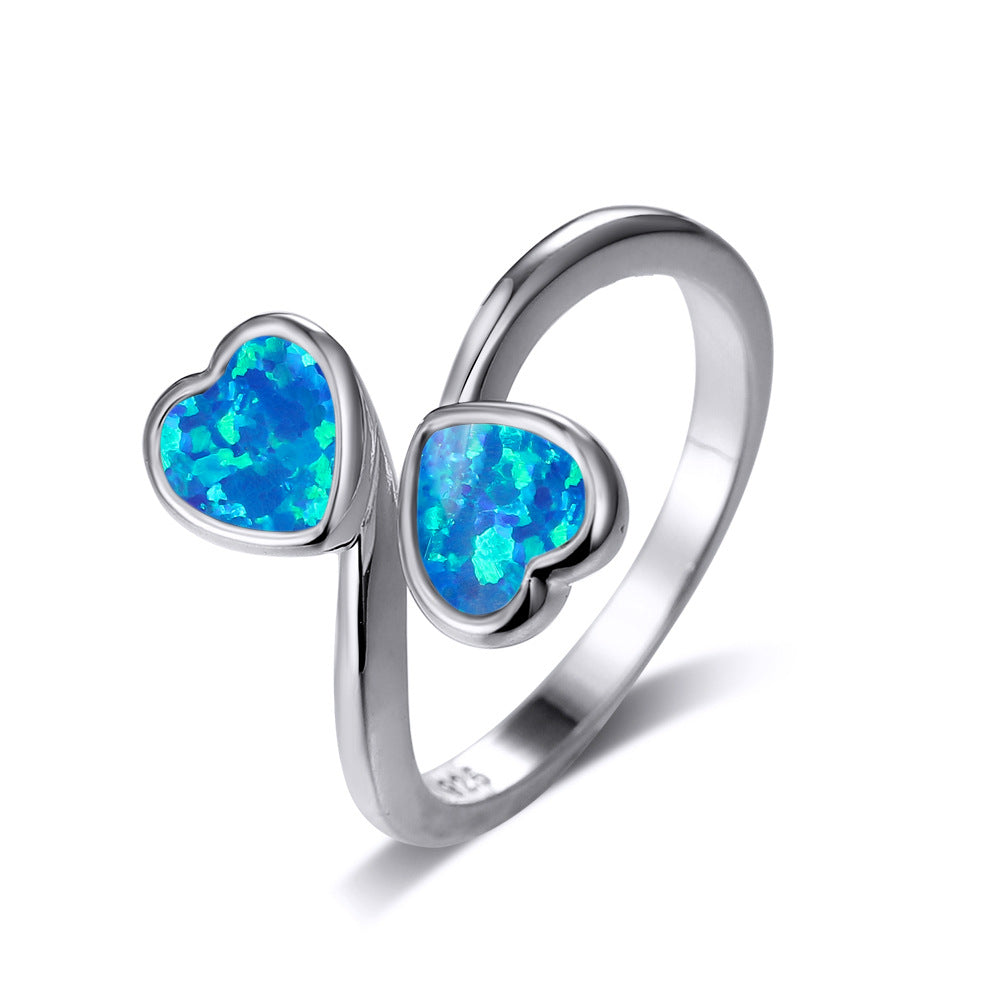 Damen Ring mit strahlendem Herzdesign und leuchtenden Opal-Effekten Shop Nory